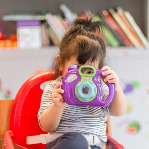 Child smiling after colorful creative play
