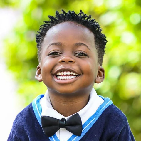 Smiling child showing confidence