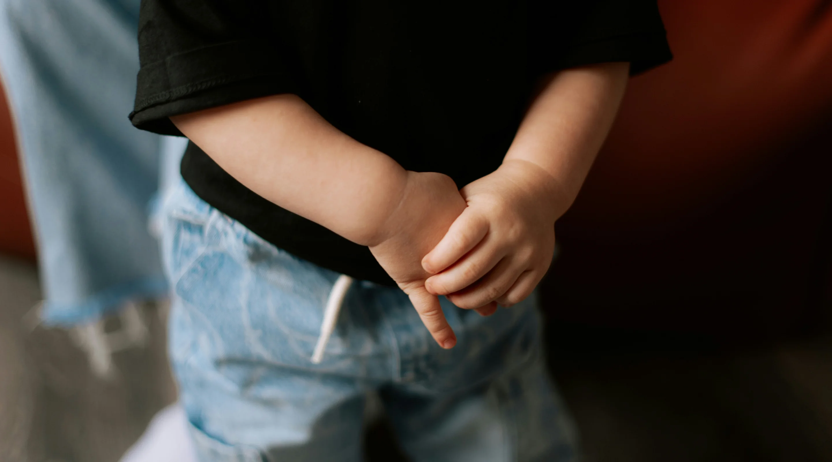 Child crossing their fingers behind their back